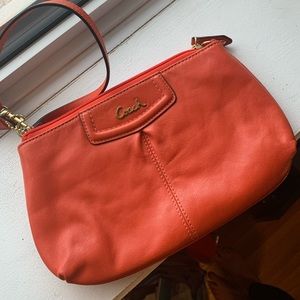 COACH Orange wristlet
